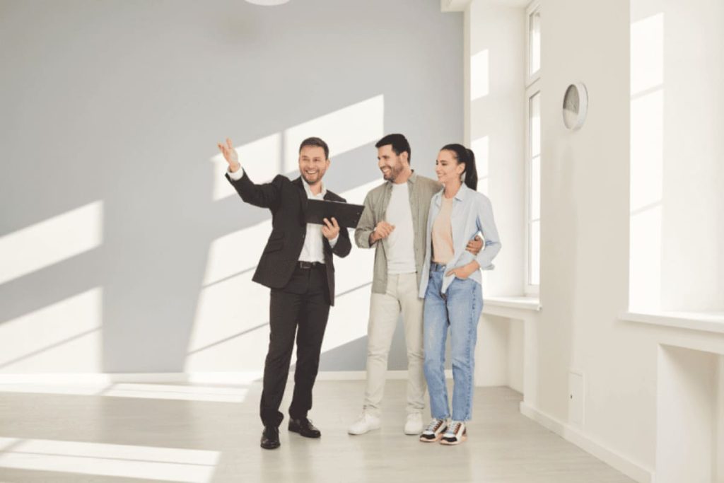 A couple with a real estate agent viewing a home – Green Lake